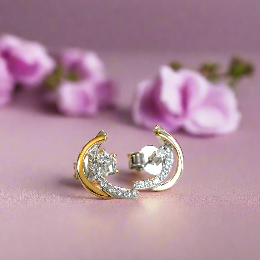 Photo of Crescent Studs in a decorative scene, designed by , available at Plumb Gold & Plumb Silver