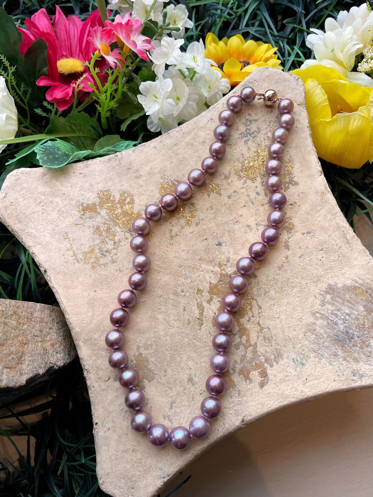 Photo of Edison Pearl Strand in a decorative scene, designed by , available at Plumb Gold & Plumb Silver