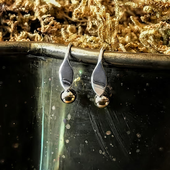 Sterling silver petite earrings with gold ball accent, available at plum silver jewelry store