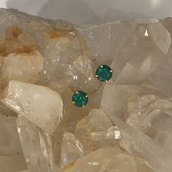 Photo of 14KY Emerald Stud Earrings 1.31Ct in a decorative scene, designed by , available at Plumb Gold & Plumb Silver