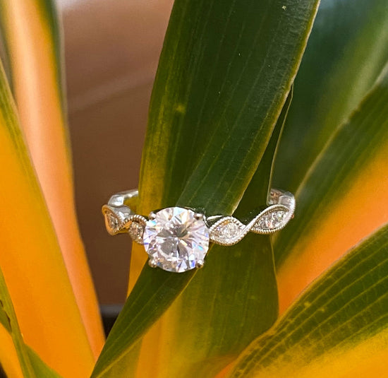 Photo of "Alicia" Engagement Ring in a decorative scene, designed by , available at Plumb Gold & Plumb Silver