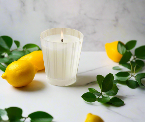 Photo of Amalfi Lemon & Mint candle in a decorative scene, designed by , available at Plumb Gold & Plumb Silver