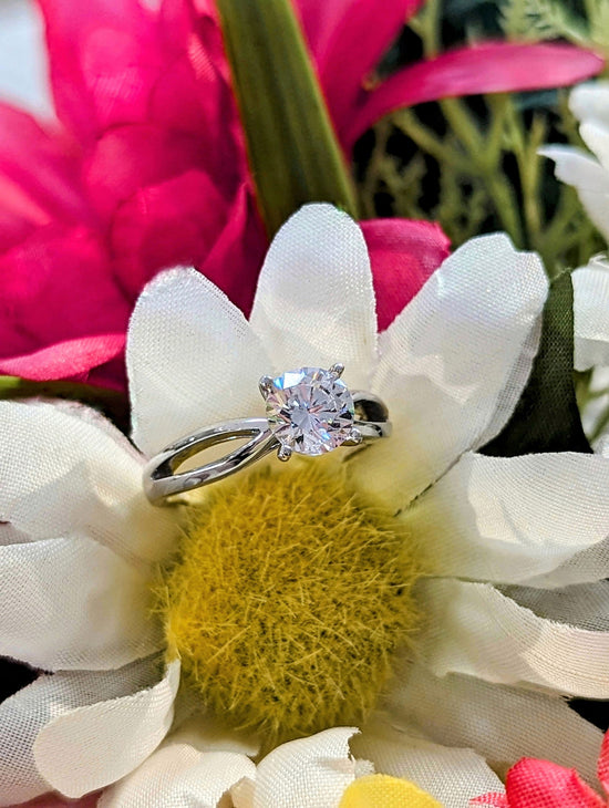 Photo of "Amelia" Engagement Ring in a decorative scene, designed by , available at Plumb Gold & Plumb Silver