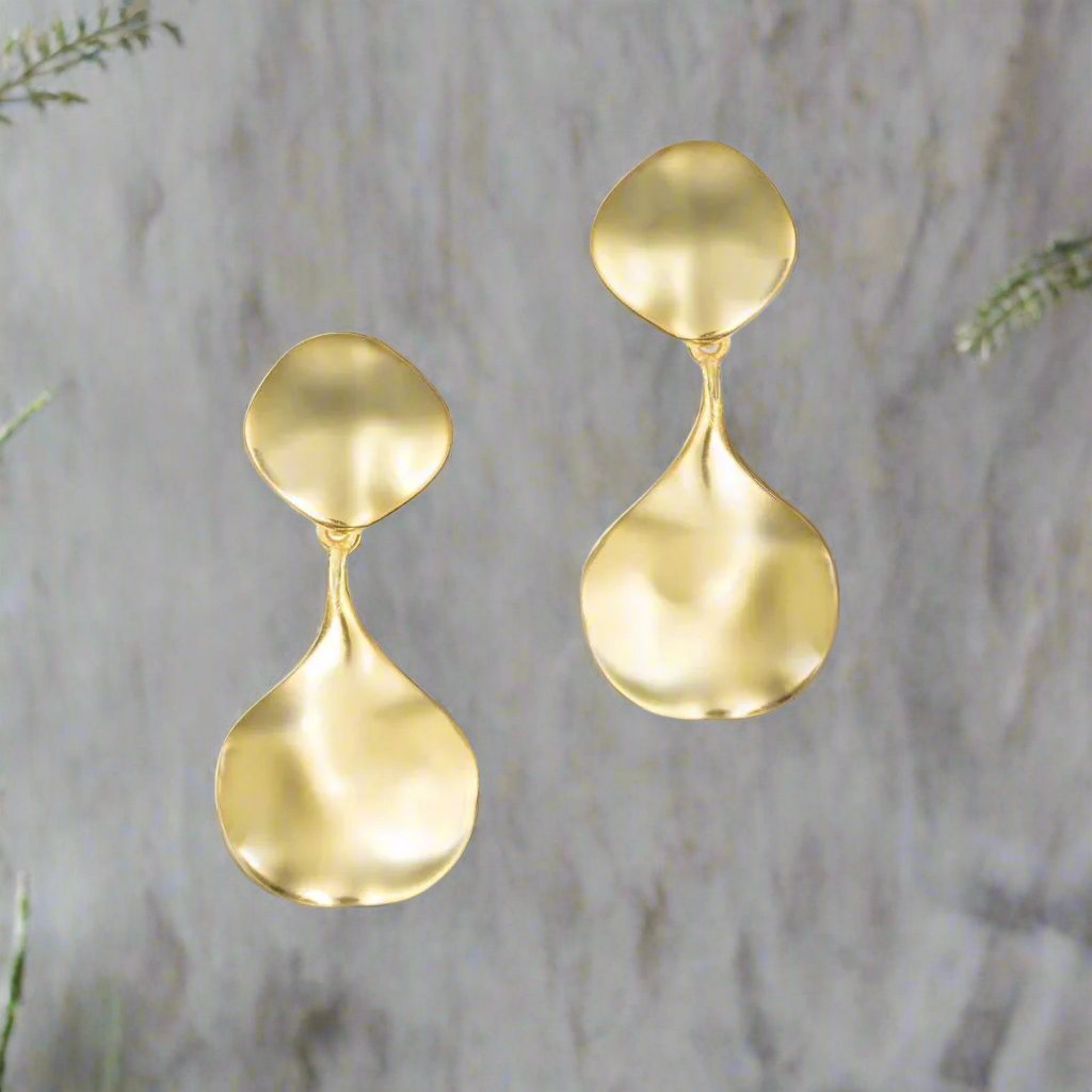 Photo of "Aqua" Earring in a decorative scene, designed by -, available at Plumb Gold & Plumb Silver