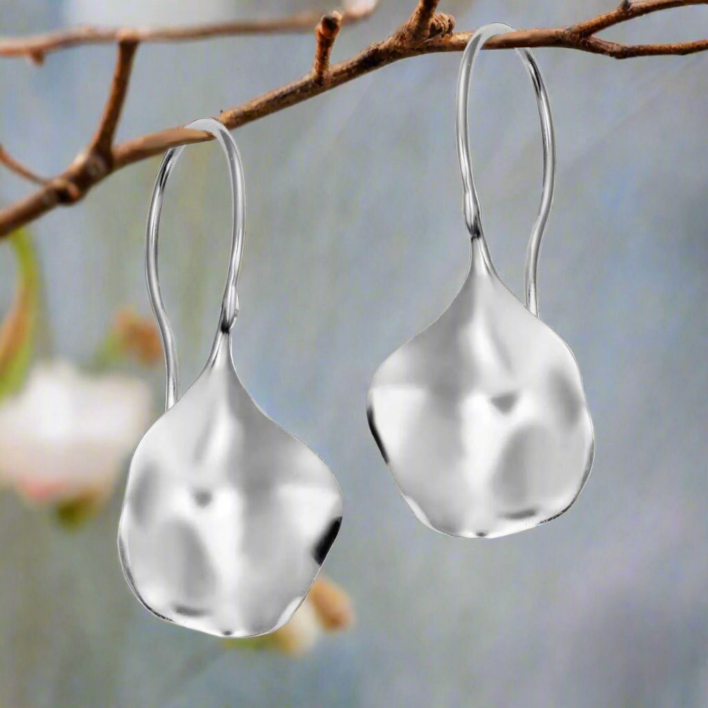 Photo of "Aqua" Earrings in a decorative scene, designed by -, available at Plumb Gold & Plumb Silver
