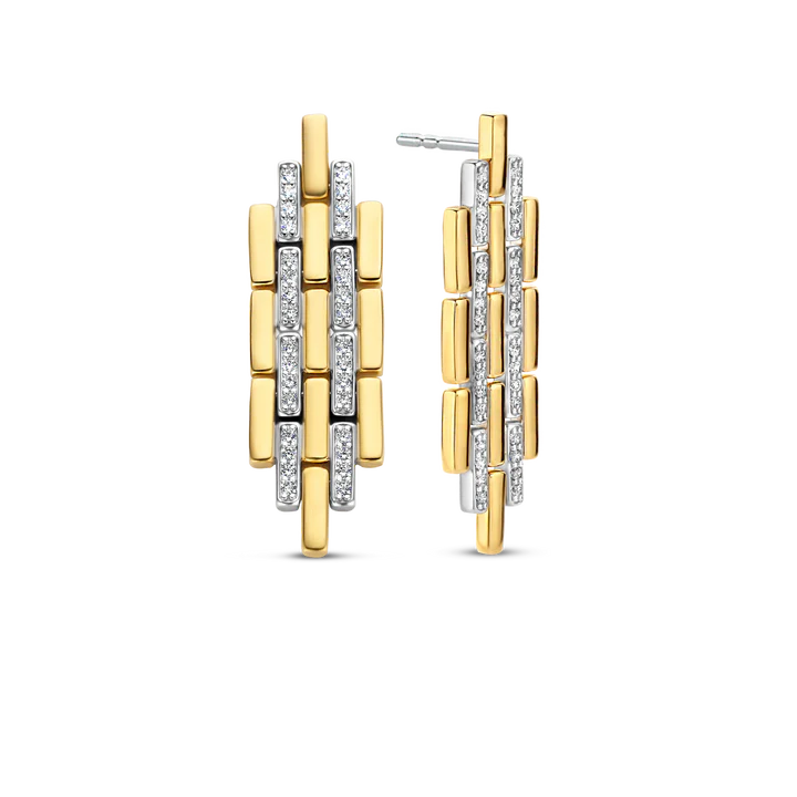 Photo of Art Deco Link Earrings in a decorative scene, designed by , available at Plumb Gold & Plumb Silver
