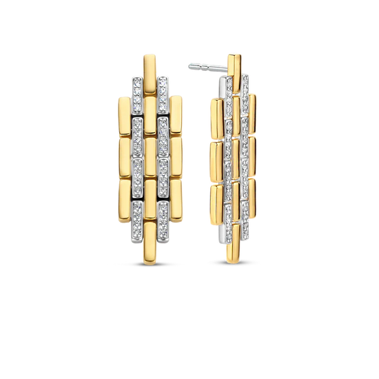 Photo of Art Deco Link Earrings in a decorative scene, designed by , available at Plumb Gold & Plumb Silver