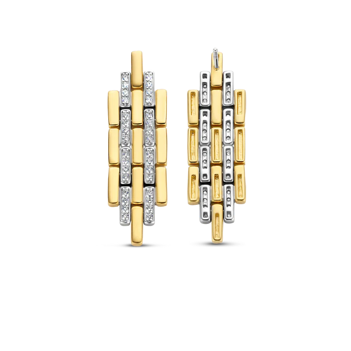 Photo of Art Deco Link Earrings in a decorative scene, designed by , available at Plumb Gold & Plumb Silver