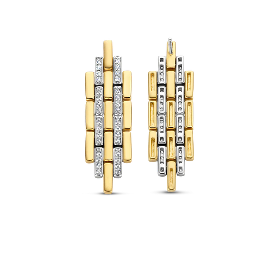 Photo of Art Deco Link Earrings in a decorative scene, designed by , available at Plumb Gold & Plumb Silver