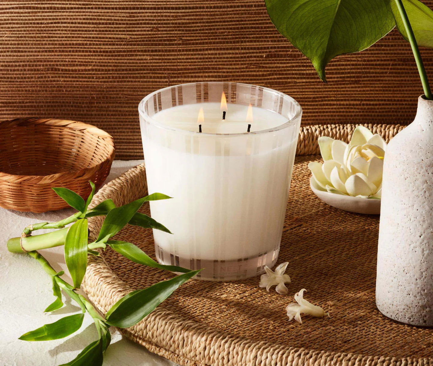 Photo of Bamboo Candle in a decorative scene, designed by , available at Plumb Gold & Plumb Silver