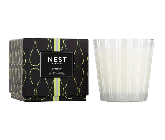 Photo of Bamboo Candle in a decorative scene, designed by , available at Plumb Gold & Plumb Silver