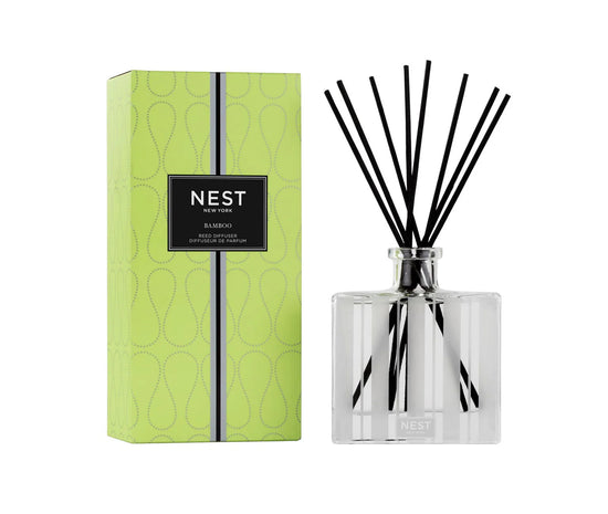 Photo of Bamboo Candle in a decorative scene, designed by , available at Plumb Gold & Plumb Silver