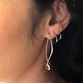 Photo of "Be-Leaf" Earrings in a decorative scene, designed by , available at Plumb Gold & Plumb Silver