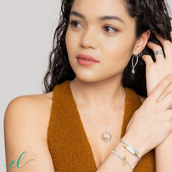 Photo of "Be-Leaf" Earrings in a decorative scene, designed by , available at Plumb Gold & Plumb Silver