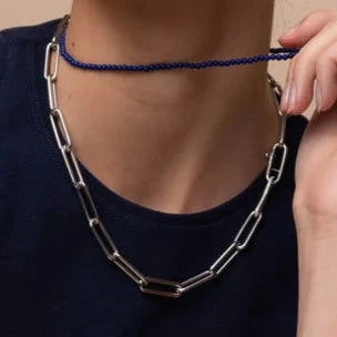 Photo of Beaded Lapis Necklace in a decorative scene, designed by , available at Plumb Gold & Plumb Silver