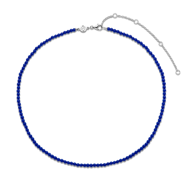 Photo of Beaded Lapis Necklace in a decorative scene, designed by , available at Plumb Gold & Plumb Silver
