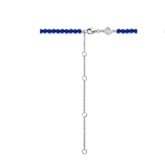 Photo of Beaded Lapis Necklace in a decorative scene, designed by , available at Plumb Gold & Plumb Silver