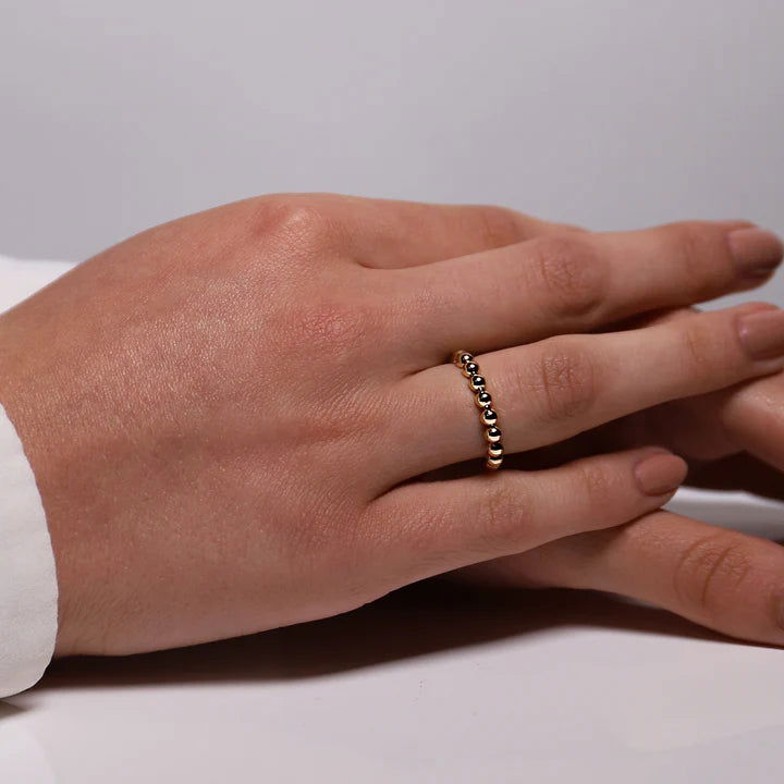 Photo of Beaded Ring in a decorative scene, designed by , available at Plumb Gold & Plumb Silver