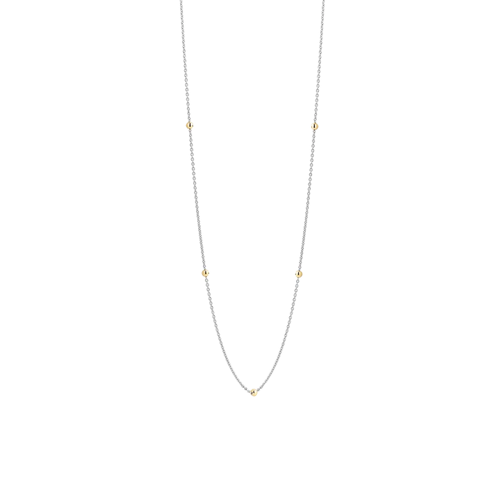 Photo of Beaded Station Necklace in a decorative scene, designed by , available at Plumb Gold & Plumb Silver