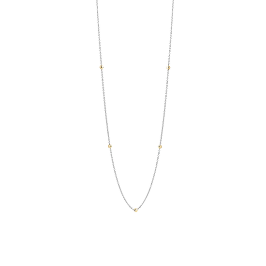 Photo of Beaded Station Necklace in a decorative scene, designed by , available at Plumb Gold & Plumb Silver