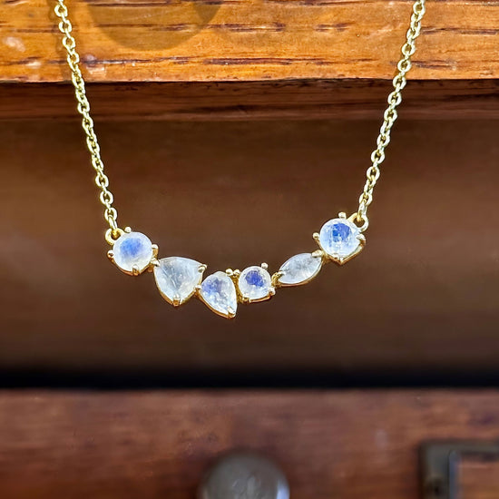 Photo of “Bella” Necklace in a decorative scene, designed by -, available at Plumb Gold & Plumb Silver