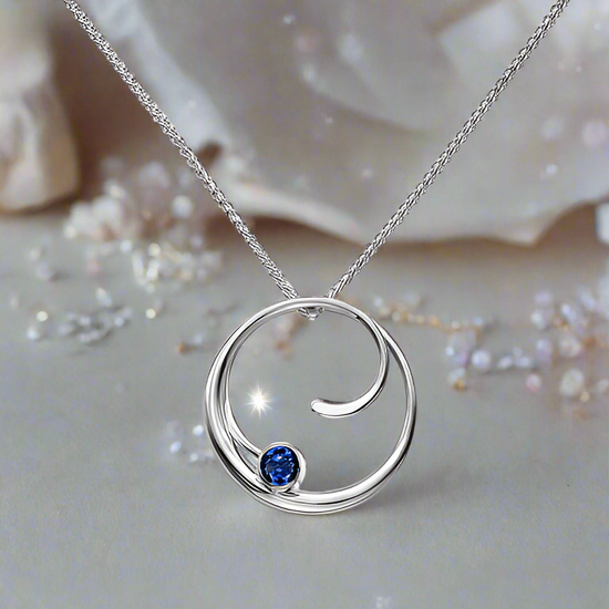 Photo of "Bindu" Necklace in a decorative scene, designed by , available at Plumb Gold & Plumb Silver