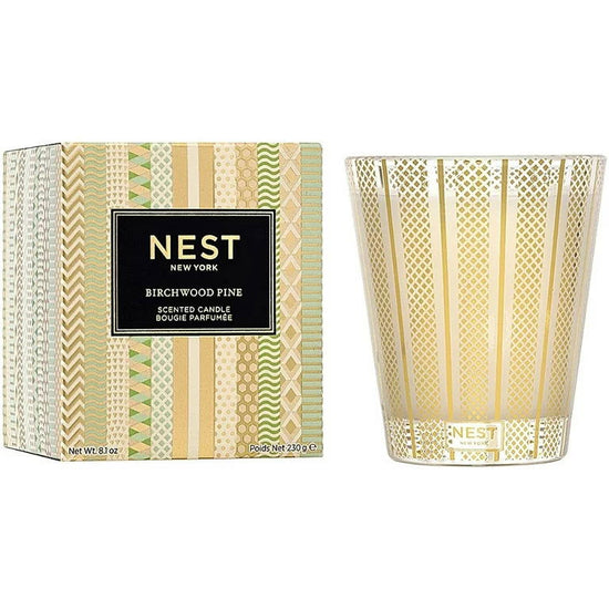 Photo of Birchwood Pine Candle in a decorative scene, designed by , available at Plumb Gold & Plumb Silver