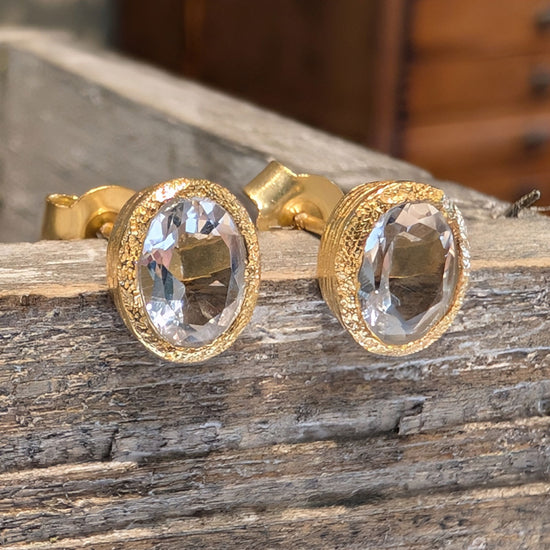 Photo of Birthstone Earrings by Jorge in a decorative scene, designed by -, available at Plumb Gold & Plumb Silver