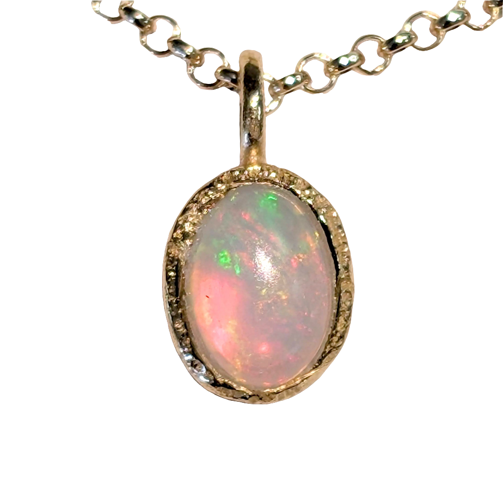 Photo of Birthstone Pendants By Jorge in a decorative scene, designed by -, available at Plumb Gold & Plumb Silver