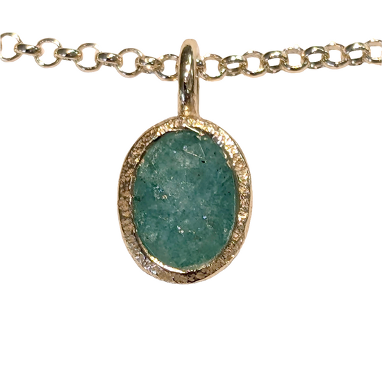 Photo of Birthstone Pendants By Jorge in a decorative scene, designed by -, available at Plumb Gold & Plumb Silver