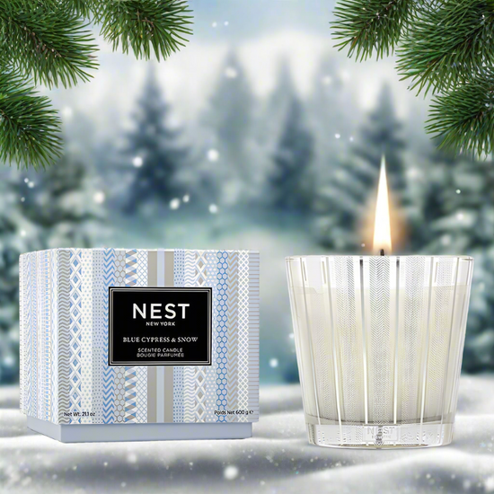 Photo of Blue Cypress & Snow Candle in a decorative scene, designed by , available at Plumb Gold & Plumb Silver