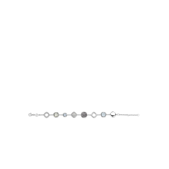 Photo of Blue Quartz and Cubic Zirconia Station Bracelet in a decorative scene, designed by , available at Plumb Gold & Plumb Silver