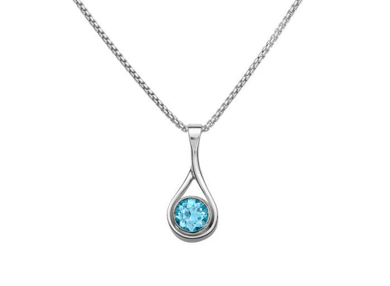 Photo of Blue Topaz "Desire" Pendant in a decorative scene, designed by , available at Plumb Gold & Plumb Silver
