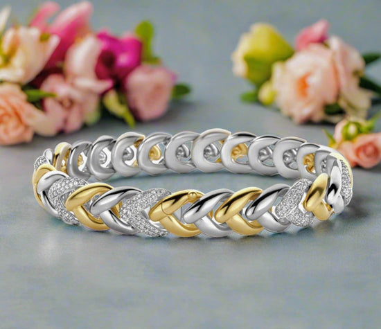 Photo of Braided Link Bracelet in a decorative scene, designed by , available at Plumb Gold & Plumb Silver