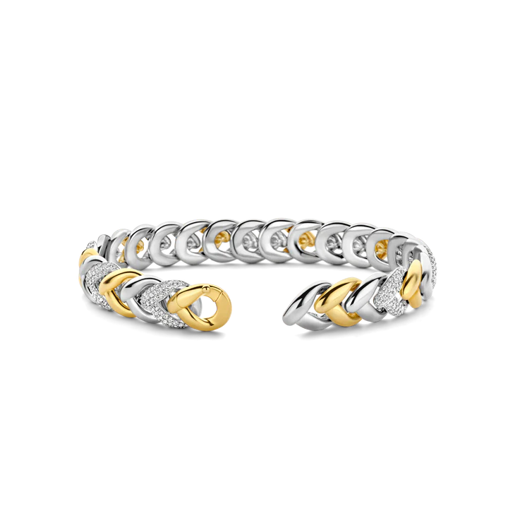Photo of Braided Link Bracelet in a decorative scene, designed by , available at Plumb Gold & Plumb Silver