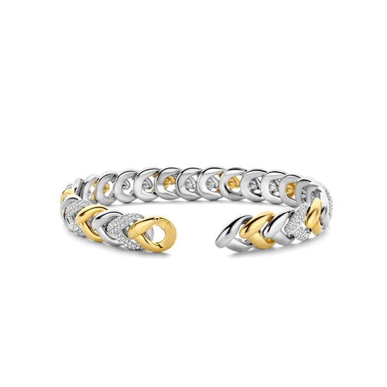 Photo of Braided Link Bracelet in a decorative scene, designed by , available at Plumb Gold & Plumb Silver