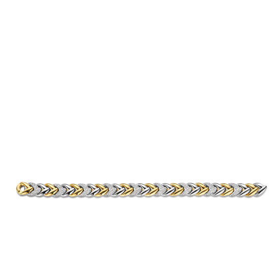 Photo of Braided Link Bracelet in a decorative scene, designed by , available at Plumb Gold & Plumb Silver