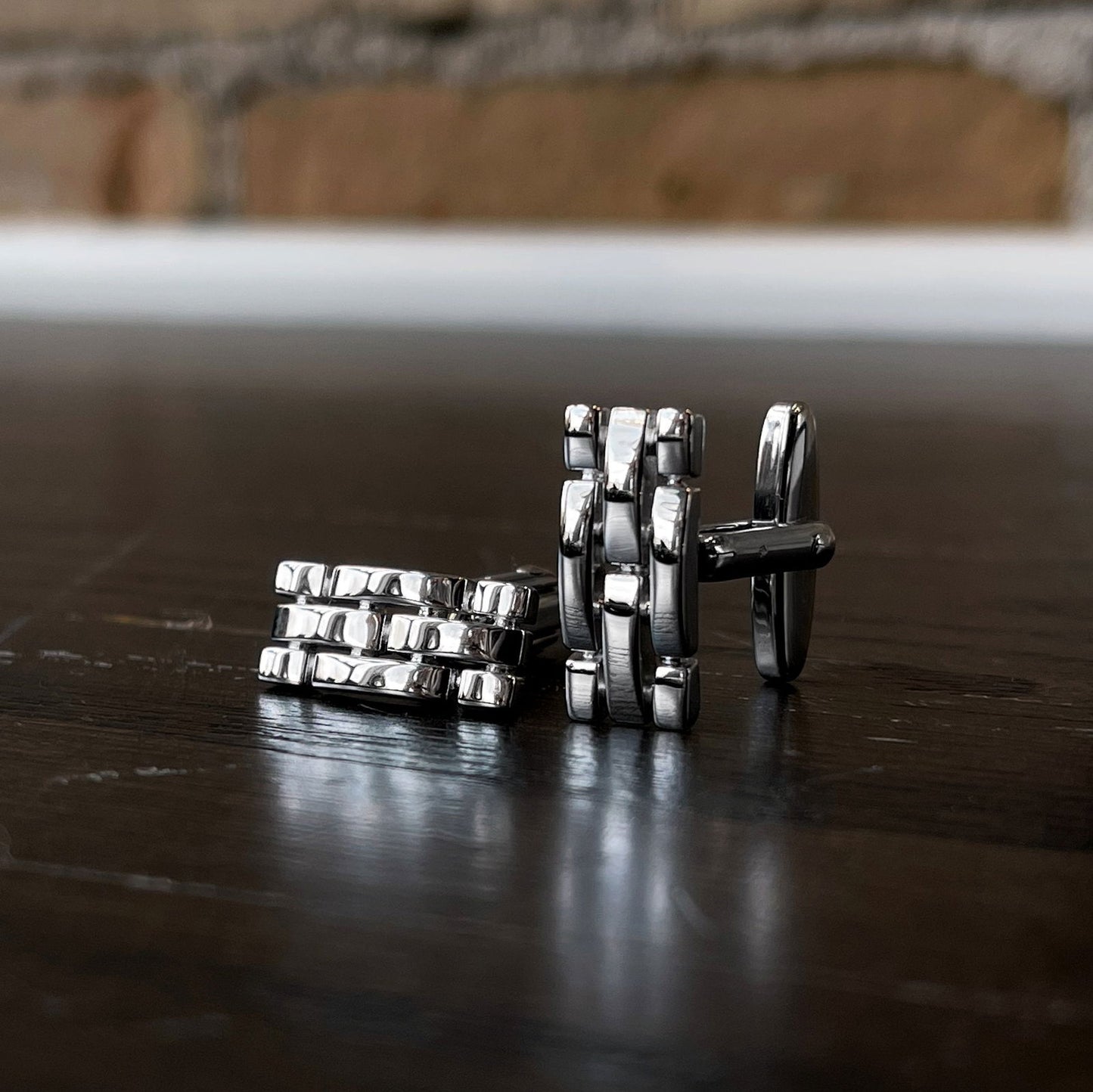 Photo of Breuning Cufflinks in a decorative scene, designed by , available at Plumb Gold & Plumb Silver