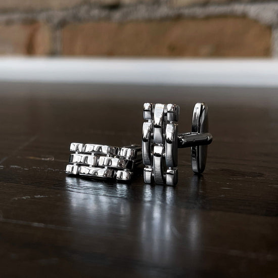 Photo of Breuning Cufflinks in a decorative scene, designed by , available at Plumb Gold & Plumb Silver
