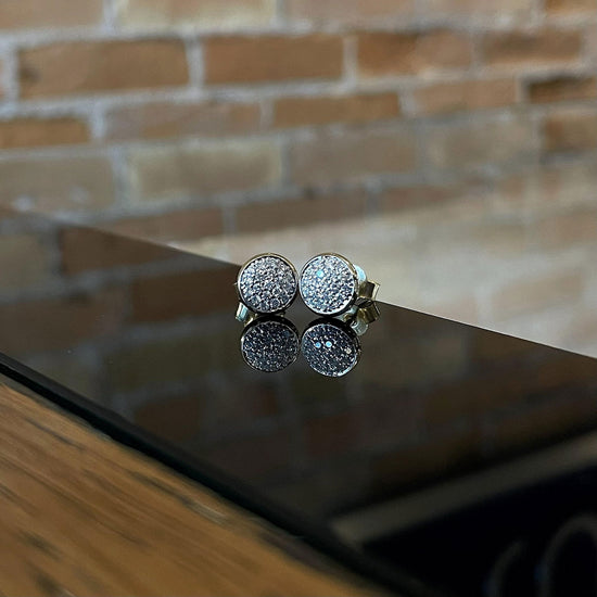 Photo of Breuning Diamond Cluster Studs in a decorative scene, designed by , available at Plumb Gold & Plumb Silver