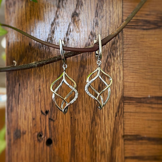 Photo of Breuning Diamond Freeform Dangles in a decorative scene, designed by , available at Plumb Gold & Plumb Silver