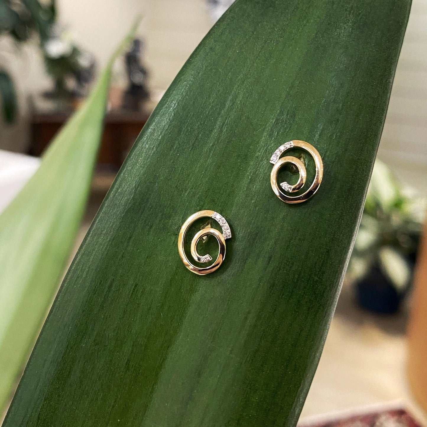 Photo of Breuning Sprial Studs in a decorative scene, designed by , available at Plumb Gold & Plumb Silver