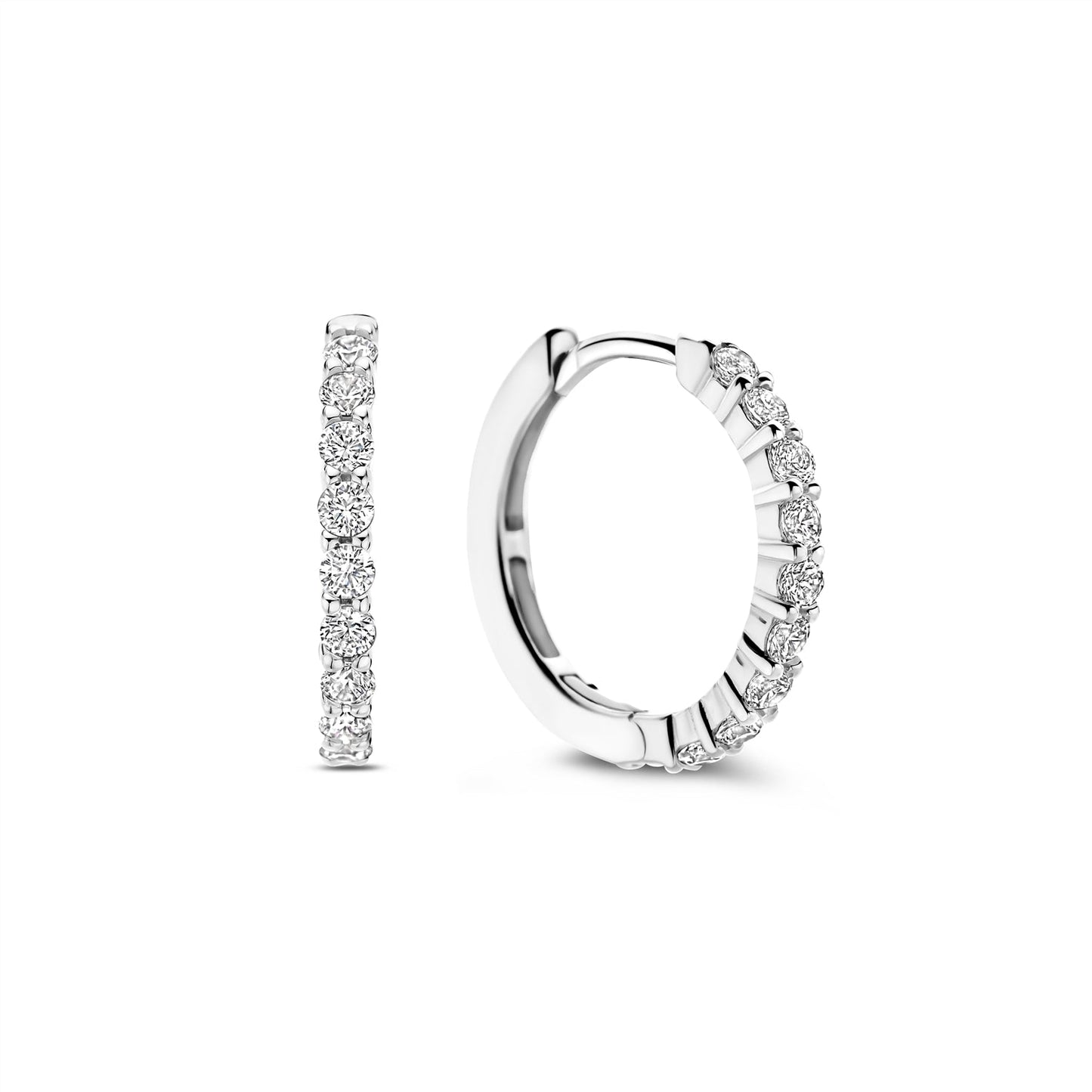 Photo of CZ Hinged Hoop Earring in a decorative scene, designed by , available at Plumb Gold & Plumb Silver