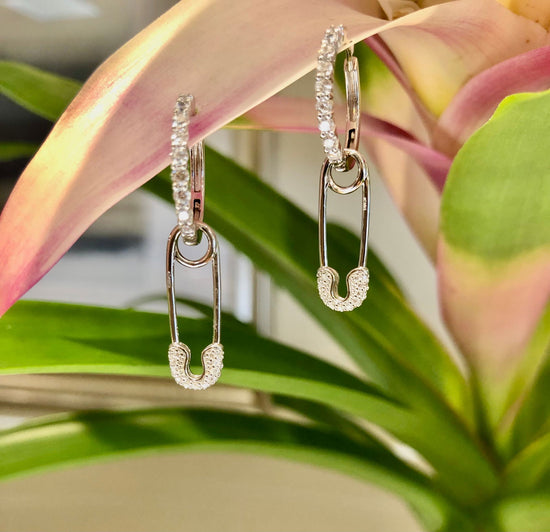 Photo of Chic pin charm in a decorative scene, designed by , available at Plumb Gold & Plumb Silver