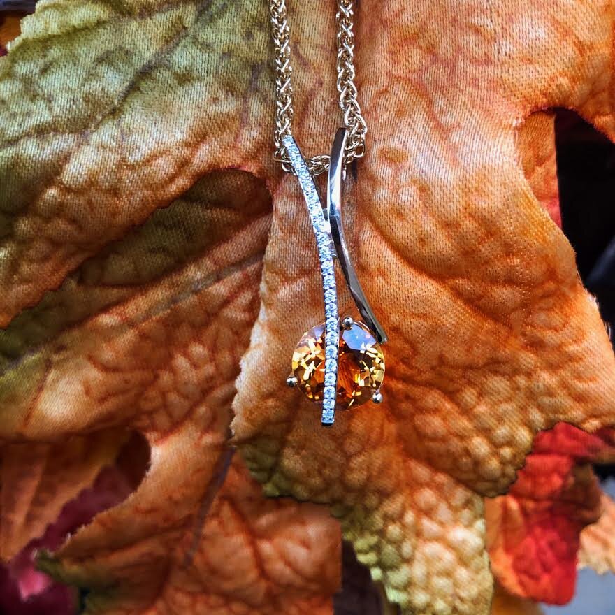 Photo of Citrine and Diamond Pendant in a decorative scene, designed by , available at Plumb Gold & Plumb Silver