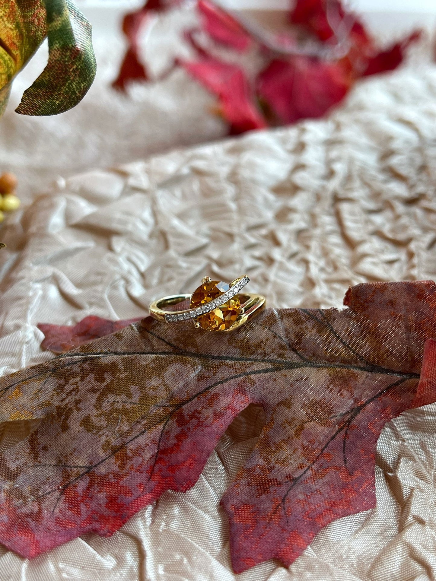Photo of Citrine and Diamond Ring in a decorative scene, designed by , available at Plumb Gold & Plumb Silver