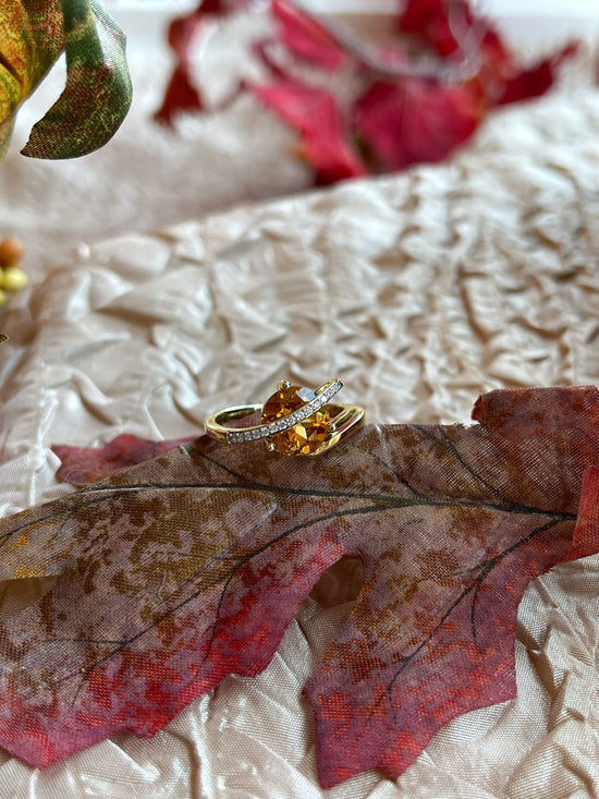 Photo of Citrine and Diamond Ring in a decorative scene, designed by , available at Plumb Gold & Plumb Silver