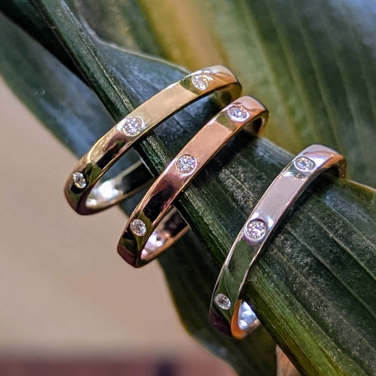 Photo of "Claire" Band in a decorative scene, designed by , available at Plumb Gold & Plumb Silver