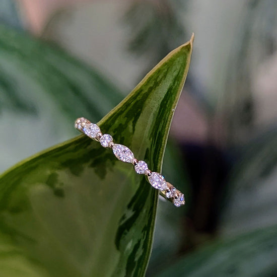 Photo of "Clarice" Band in a decorative scene, designed by , available at Plumb Gold & Plumb Silver