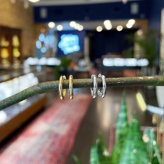 Photo of Classic Hinged Hoop in a decorative scene, designed by , available at Plumb Gold & Plumb Silver
